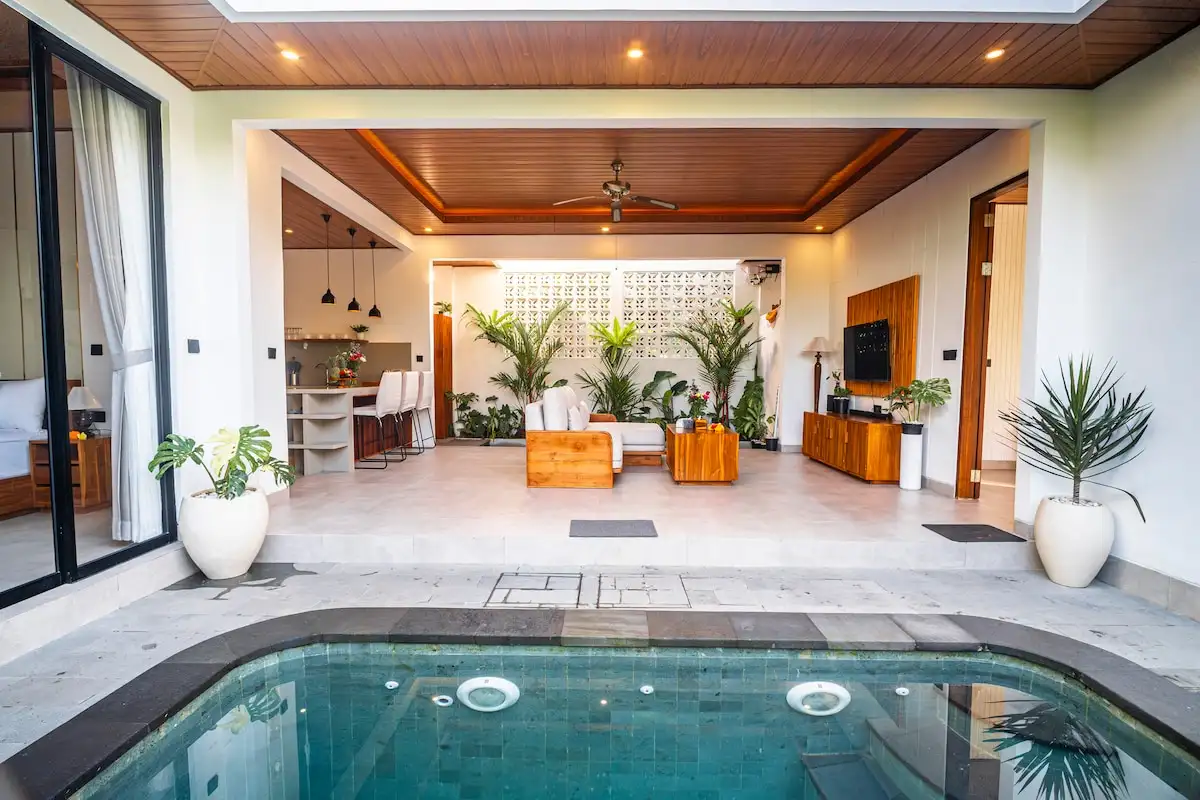 Pool deck with loungers at Aung Villa, Ubud